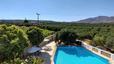 an overhead view of a swimming pool with trees and hills at Villa 