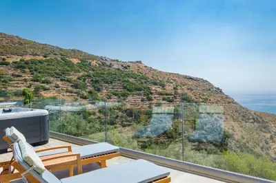a balcony with a view of a mountain at INO I, sea goddess domus jacuzzi by Amigdalokefali Elafonissi in Kissamos