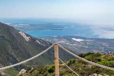 a suspension bridge on top of a mountain at INO I, sea goddess domus jacuzzi by Amigdalokefali Elafonissi in Kissamos