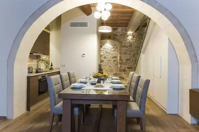 a kitchen and dining room with a table and chairs at Kamartsos Villa 3 in Áyios Yeóryios