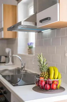 a bowl of fruit on a counter in a kitchen at B&M HOUSE,SIRILI,PLATANIAS in Metókhion Sirilíou