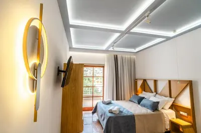 a bedroom with a bed and a window at Manos Studios in Palaiochóra