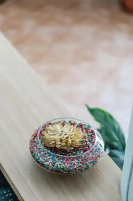 a bowl with a flower in it on a table at Manos Studios in Palaiochóra