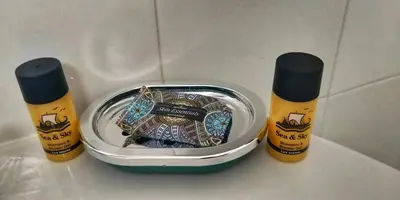 two products sitting on a counter next to a container at Alexandra Hotel in Kalamaki Chanion