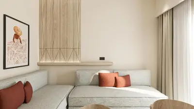 a living room with a couch with orange pillows at Falassarna Beach studios&apartments in Falasarna