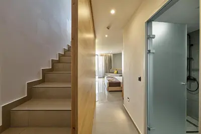 a staircase leading to a bedroom in a house at Galini Palace in Kolymvari