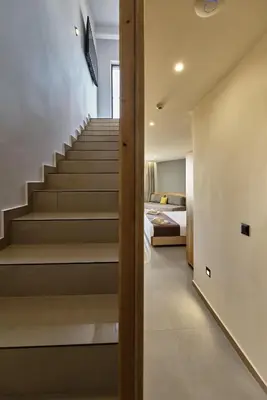 a staircase leading to a bedroom in a house at Galini Palace in Kolymvari