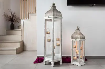 two glass lanterns on the floor in a room at Boutique Home -Splantzia-Roof Garden in Chania Town