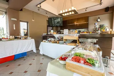 a kitchen with a counter with vegetables on a table at Okeanis II in Kato Daratso