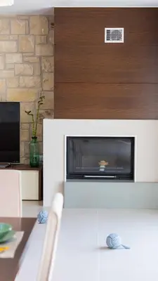 a living room with a fireplace and a tv at Villa Emilia I Luxury, amazing seaview, next to the town in Kissamos