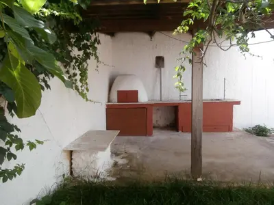 a bench sitting in front of a building with a desk at Pentari in Stalos