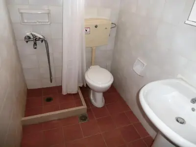a small bathroom with a toilet and a sink at Pentari in Stalos