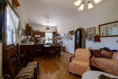a living room with a couch and a table at Traditional Family Cretan Home! in Yerakianá