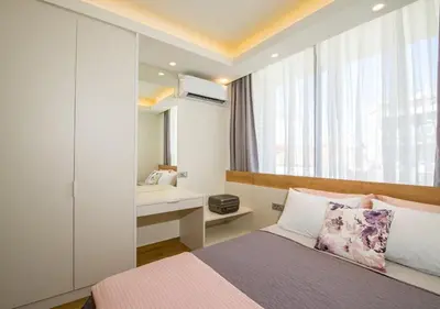 a bedroom with a bed with a window and a desk at Modern Chic Studio - Chania City Center - Parking in Chania Town