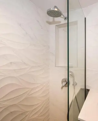 a bathroom with a shower with a glass door at Modern Chic Studio - Chania City Center - Parking in Chania Town