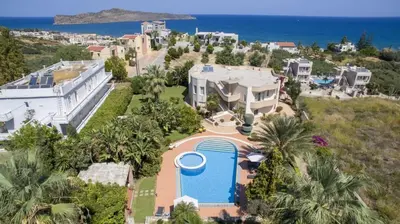 an aerial view of a house with a pool at Villa Elina Luxury Residence in Stalos