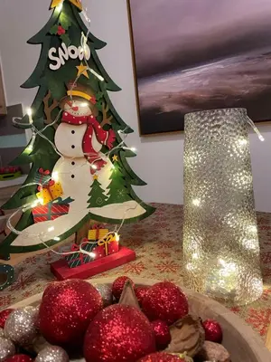 a christmas tree sitting next to a plate of food at Luxury Villa Mystique with Amazing Seaview in Chania Town