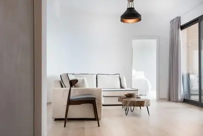 a living room with a couch and a table at Luxury Villa Mystique with Amazing Seaview in Chania Town