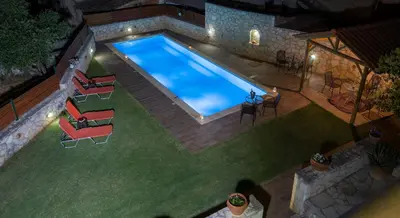 an overhead view of a swimming pool in a yard at Skandalis Apartments with pool in Chorafakia