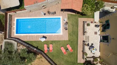 an overhead view of a swimming pool in a yard at Skandalis Apartments with pool in Chorafakia