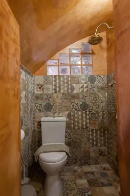 a bathroom with a toilet in a room at Aristokosmos in Chania Town