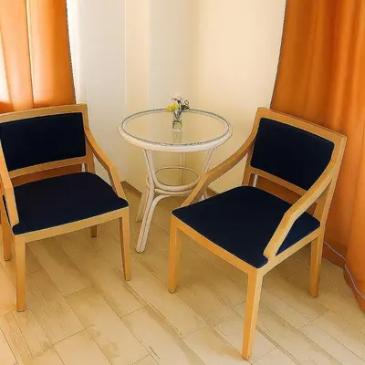 two chairs and a table with a table and two chairs at Elafonisi Villa above the Beach in Elafonisi