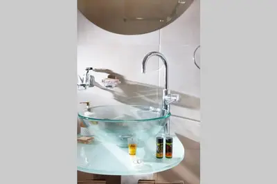 a sink in a bathroom with a faucet at Chania Green House 1 in SFakianalíon