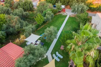 an aerial view of a yard with chairs and trees at Chania Green House 2 in Aghii Apostoli