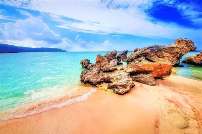 a beach with some rocks and the water at Villa Vardis Heated Pool in Vryses
