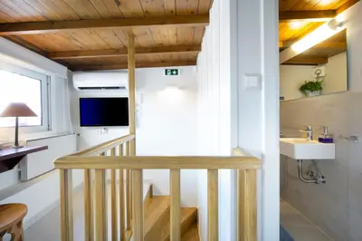 a tiny house with a staircase and a sink at Kallinikou Residence - private parking on demand - in Chania Town