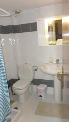 a bathroom with a toilet and a sink at Summer Holidays Studio in Chania Town