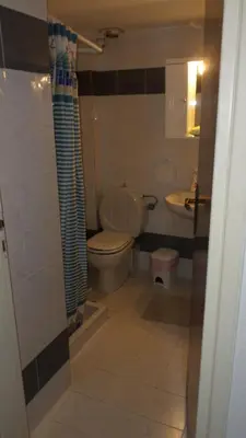 a bathroom with a toilet and a sink at Summer Holidays Studio in Chania Town