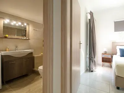 a bathroom with a sink and a toilet at Villa Nikos Megala Chorafia Crete in Áptera