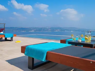 a patio with a view of the water at Villa Nikos Megala Chorafia Crete in Áptera
