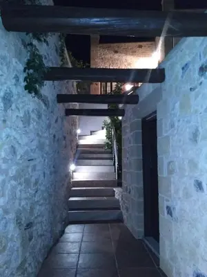 a stone hallway with stairs in a stone building at Charming villa in Chania with parking included in Kolymvari