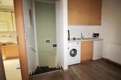 a kitchen with a washing machine and a sink at Amoutsa Seaside Villa in Kolymvari