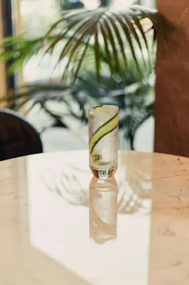 a glass vase sitting on top of a table at Chania Flair Boutique Hotel, Adults only, Tapestry Collection by Hilton in Chania Town