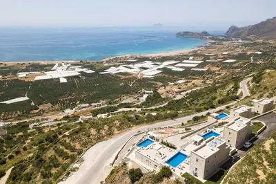 an aerial view of a resort and the ocean at Blue Horizon Luxury Villas in Falasarna