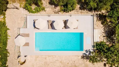 an overhead view of a swimming pool on a beach at Villa Konstantinos Hilltop Vineyard Escape in Chania Town