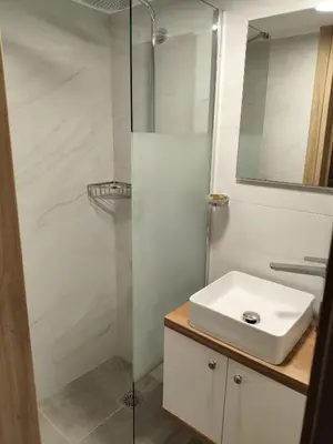 a bathroom with a sink and a shower at Protopapas in Palaiochóra