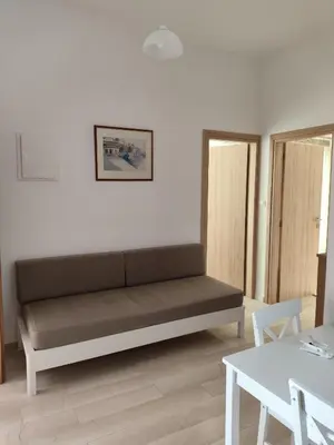 a living room with a couch and a table at Protopapas in Palaiochóra
