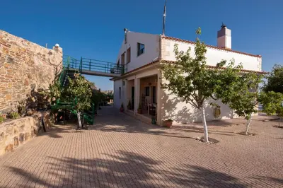 a building with a staircase on the side of it at Best View Mountain Villa in Teménia