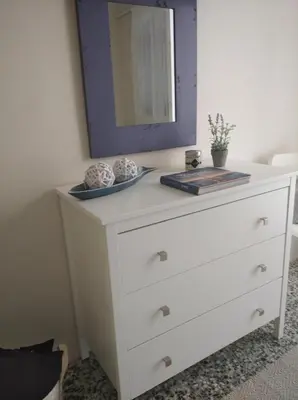 a white dresser with a mirror on top of it at Marinos Suites in Chania Town