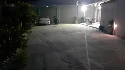 a parking lot with a car parked in a garage at GIANNIS in Galatás