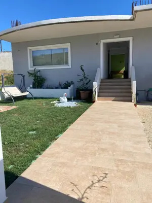 a house with a pathway leading to the front yard at Stellina's new studio 5min from beach in Souda