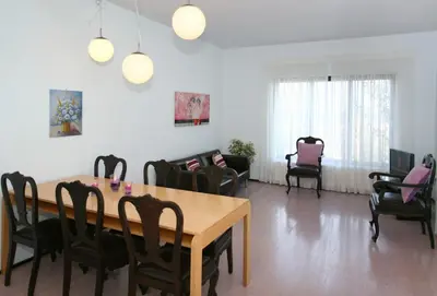 a dining room with a table and chairs at Villa Bamboo in Maleme
