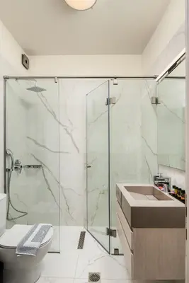 a bathroom with a shower and a sink at Amaré Chania Luxury Residence in Stérnai