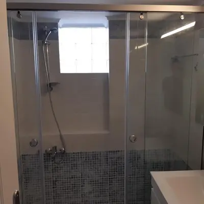 a shower with a glass door in a bathroom at Captain Nick in Chania Town