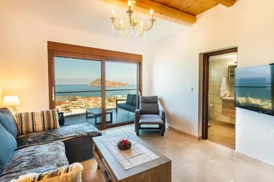 a living room with a view of the ocean at Platania's Horizon in Plataniás