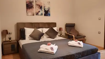 a bedroom with a bed with towels on it at Creta Galini House in Sirílion
